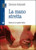 La mano stretta. Storia di un padre felice