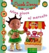 Nina gioca al mercato