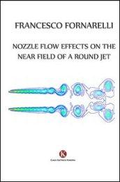 Nozzle flow effects on the near field of a round jet